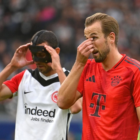 Harry Kane im duell mit Ellyes Skhiri